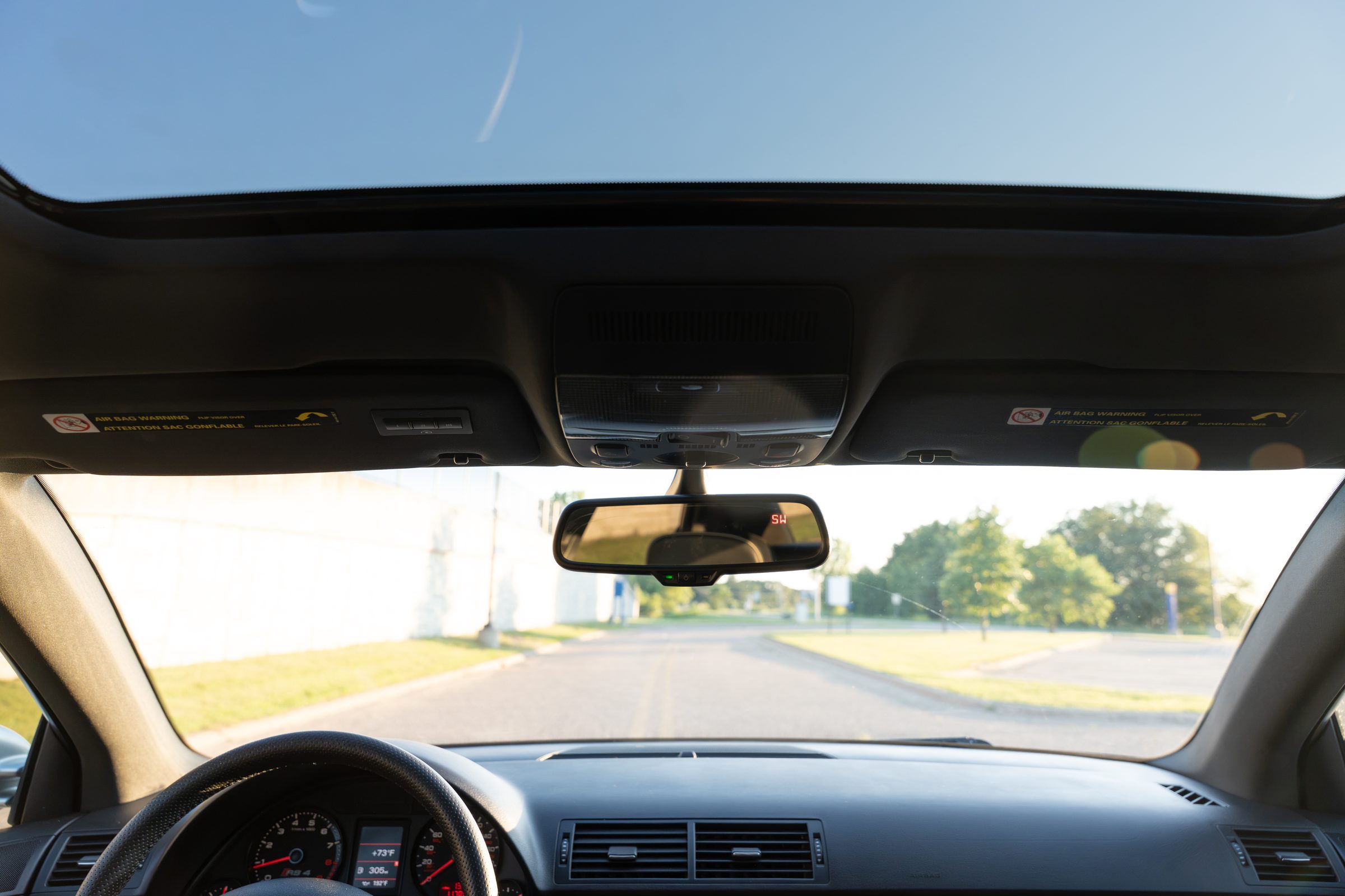 View through windshield toward the road